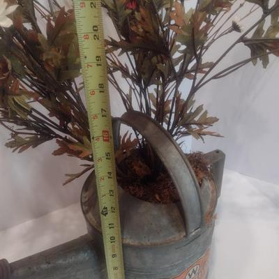 Vintage Galvanized Watering Can Being Used as a Planter