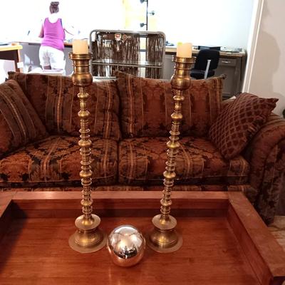 2 TALL BRASS CANDLE HOLDERS AND A GAZING BALL