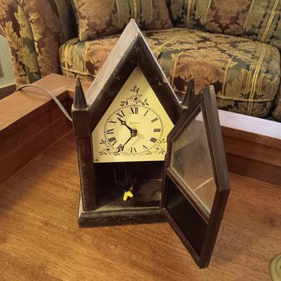SESSIONS ELECTRIC CLOCK AND A BRASS CRANE