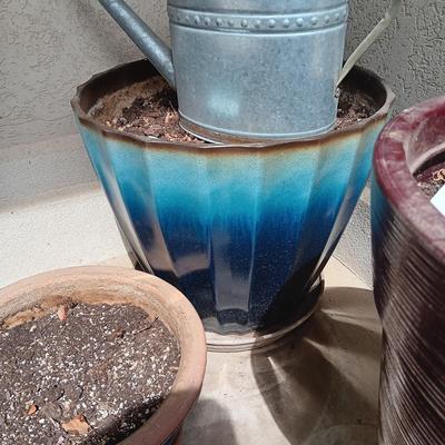 PLASTIC LARGER AND CLAY FLOWER POTS PLUS METAL WATERING CAN