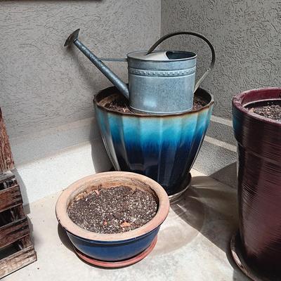 PLASTIC LARGER AND CLAY FLOWER POTS PLUS METAL WATERING CAN