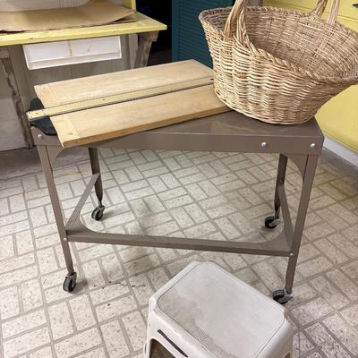 Vintage metal table on wheels, basket, footstool, and