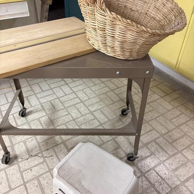 Vintage metal table on wheels, basket, footstool, and