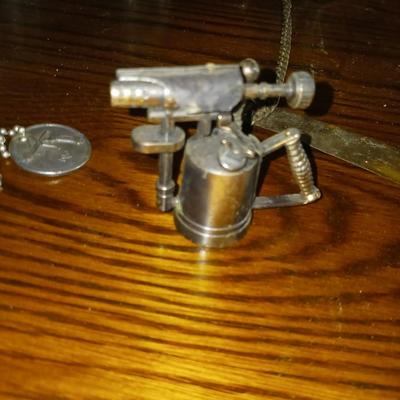 INSULATORS, TORCH PENCIL SHARPENER, WINDCHIME, BELL AND KEYS