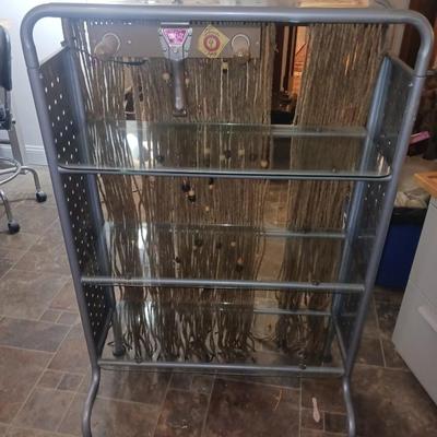METAL FRAMED WITH GLASS SHELVES DISPLAY CASE PLUS MACRAME BACKGROUND
