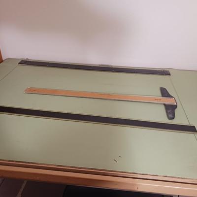 DRAFTING TABLE W/ CHAIR, TOOLS AND LARGE SHEETS OF PAPER