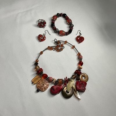 Silver Necklace with red and orange beads/stones.
