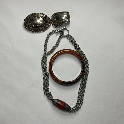 Silver belt buckler, Silver Nk, brown/orange bracelet