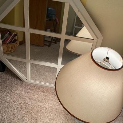 White frame mirror and wicker lamp