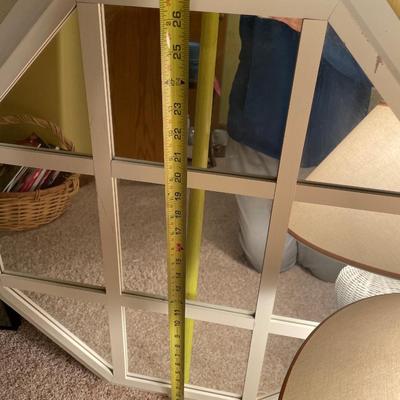 White frame mirror and wicker lamp