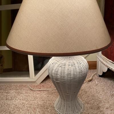 White frame mirror and wicker lamp