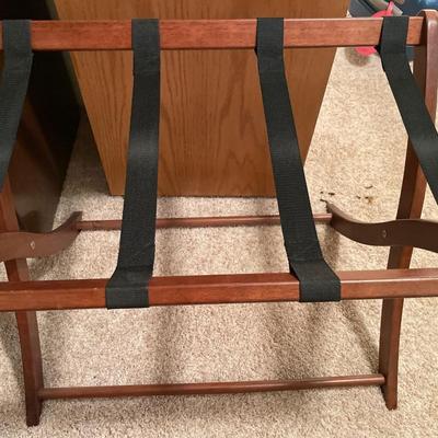 Small hard sided carryon suitcase and rack