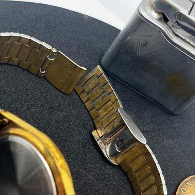 LOT: 106J: Junk Drawer Lot: Lorus Men's Watch (Not Working), Pocket Knives, Vintage Colibri Lighter and 1914 British Penny