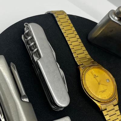 LOT: 106J: Junk Drawer Lot: Lorus Men's Watch (Not Working), Pocket Knives, Vintage Colibri Lighter and 1914 British Penny