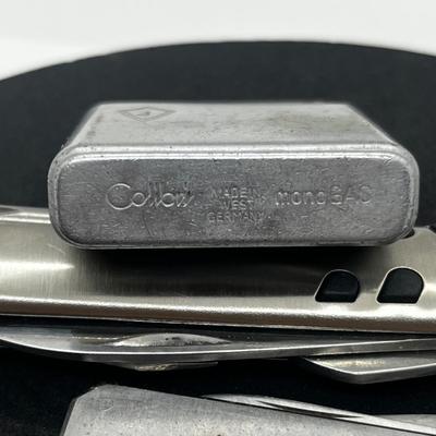 LOT: 106J: Junk Drawer Lot: Lorus Men's Watch (Not Working), Pocket Knives, Vintage Colibri Lighter and 1914 British Penny