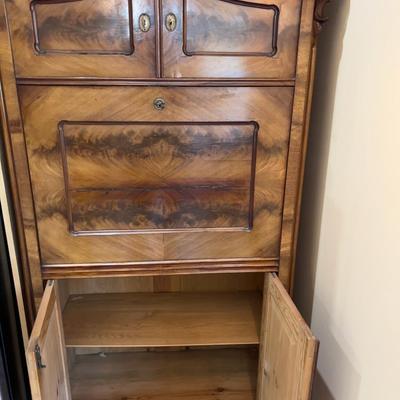 Sale Photo Thumbnail #24: Rare Antique Flame Walnut European Secretary Desk, beautiful condition with the original keys, there is some wear and shrinkage which is to be expected on this early 20th century piece. This item was shipped from Germany by the original owner. Measures 36