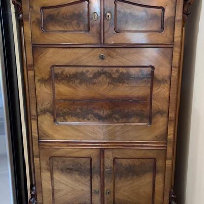 Sale Photo Thumbnail #1: Rare Antique Flame Walnut European Secretary Desk, beautiful condition with the original keys, there is some wear and shrinkage which is to be expected on this early 20th century piece. This item was shipped from Germany by the original owner. Measures 36