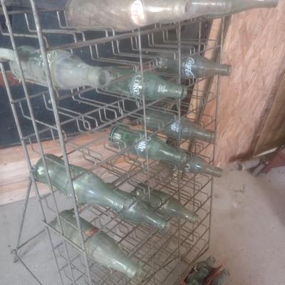 Vintage Wire Frame Soda Bottle Display Rack with Mixed Brand Bottles