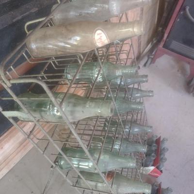 Vintage Wire Frame Soda Bottle Display Rack with Mixed Brand Bottles