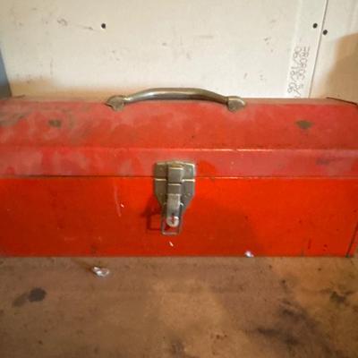 Red metal toolbox with tools