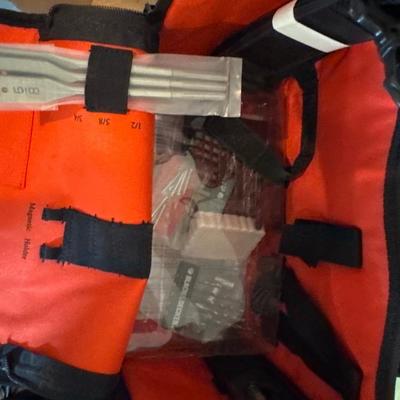 Black & Decker drill with bits and red bag