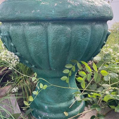 Green painted fountain with decoration