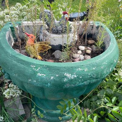 Green painted fountain with decoration