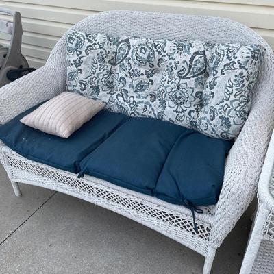 White wicker, loveseat, and table