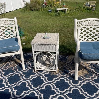2 white outdoor chairs and table