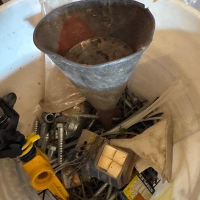 Tote and bucket of household hardware