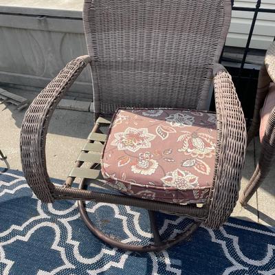 Brown wicker chairs and table