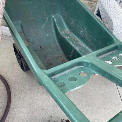 Wheelbarrow and hose with reel
