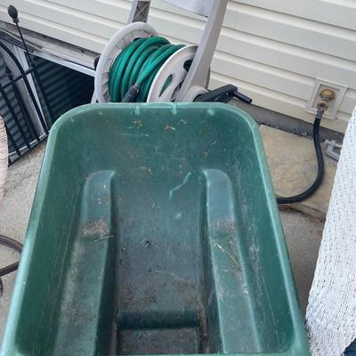 Wheelbarrow and hose with reel