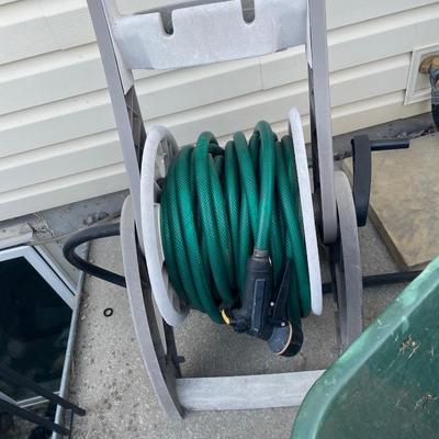 Wheelbarrow and hose with reel