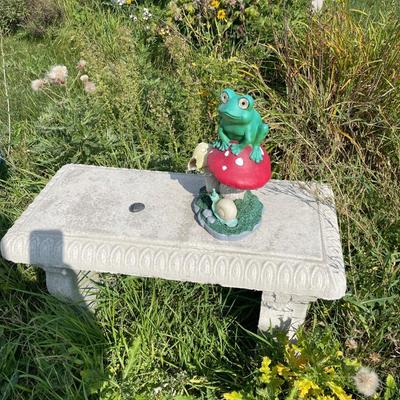 Outdoor bench with frog