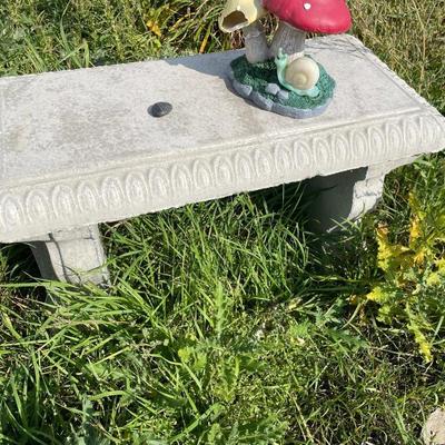 Outdoor bench with frog