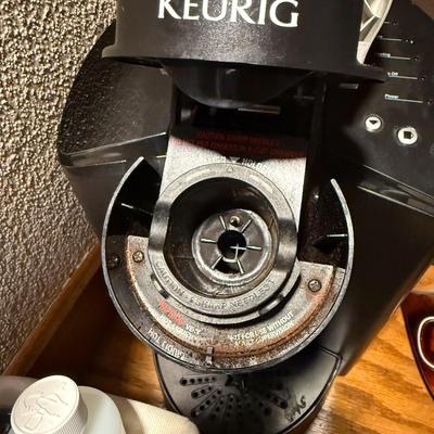 Sale Photo Thumbnail #723: Keurig, cup holder, basket and contetns