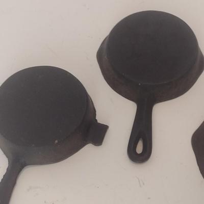 Set of Three Vintage Miniature Cast Iron Advertising Skillets and Ashtray