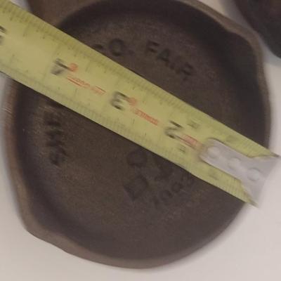 Set of Three Vintage Miniature Cast Iron Advertising Skillets and Ashtray