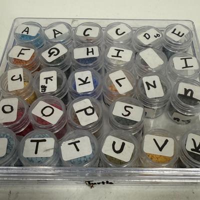 Vintage Seed Bead Storage Tray with individual lidded bottles labeled by previous owner