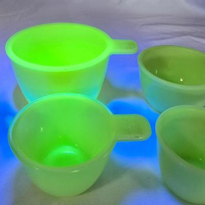 LOT 113G: Uranium Glass Measuring Cups, Gold Rimmed Ceramic Mixing Bowls, and 2 Glass Canisters