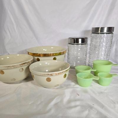LOT 113G: Uranium Glass Measuring Cups, Gold Rimmed Ceramic Mixing Bowls, and 2 Glass Canisters