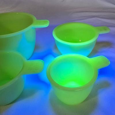 LOT 113G: Uranium Glass Measuring Cups, Gold Rimmed Ceramic Mixing Bowls, and 2 Glass Canisters