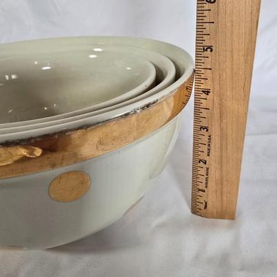 LOT 113G: Uranium Glass Measuring Cups, Gold Rimmed Ceramic Mixing Bowls, and 2 Glass Canisters