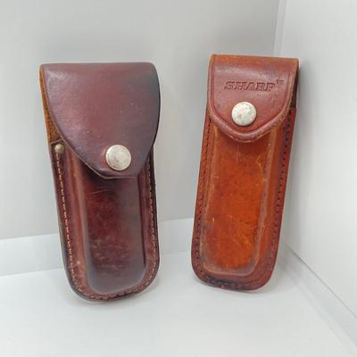 LOT 73: Pair of Sharp 300 Folding Knives with Leather Sheaths