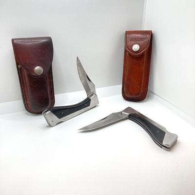LOT 73: Pair of Sharp 300 Folding Knives with Leather Sheaths