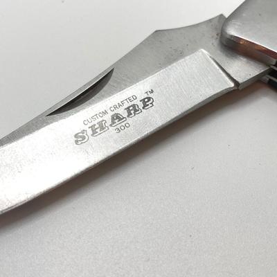 LOT 73: Pair of Sharp 300 Folding Knives with Leather Sheaths