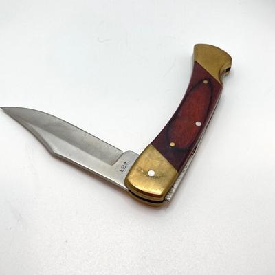 LOT 75: Vintage Uncle Henry Schrade Folding Knife with Leather Sheath