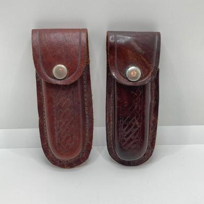 LOT 76: Pair of Folding Knives with Leather Sheaths
