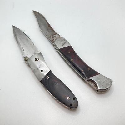 LOT 76: Pair of Folding Knives with Leather Sheaths